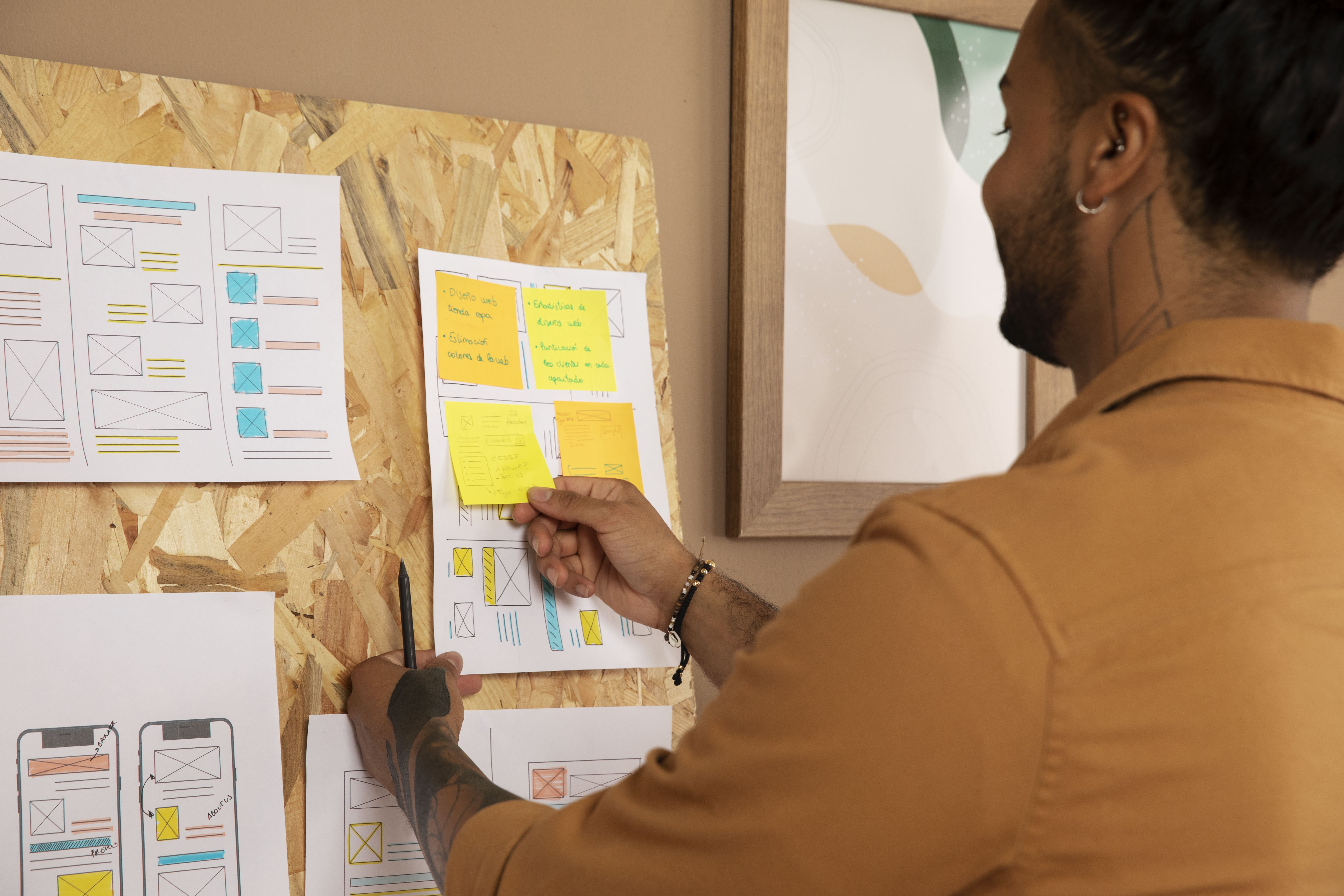 A UX designer mapping out wireframes and ideating