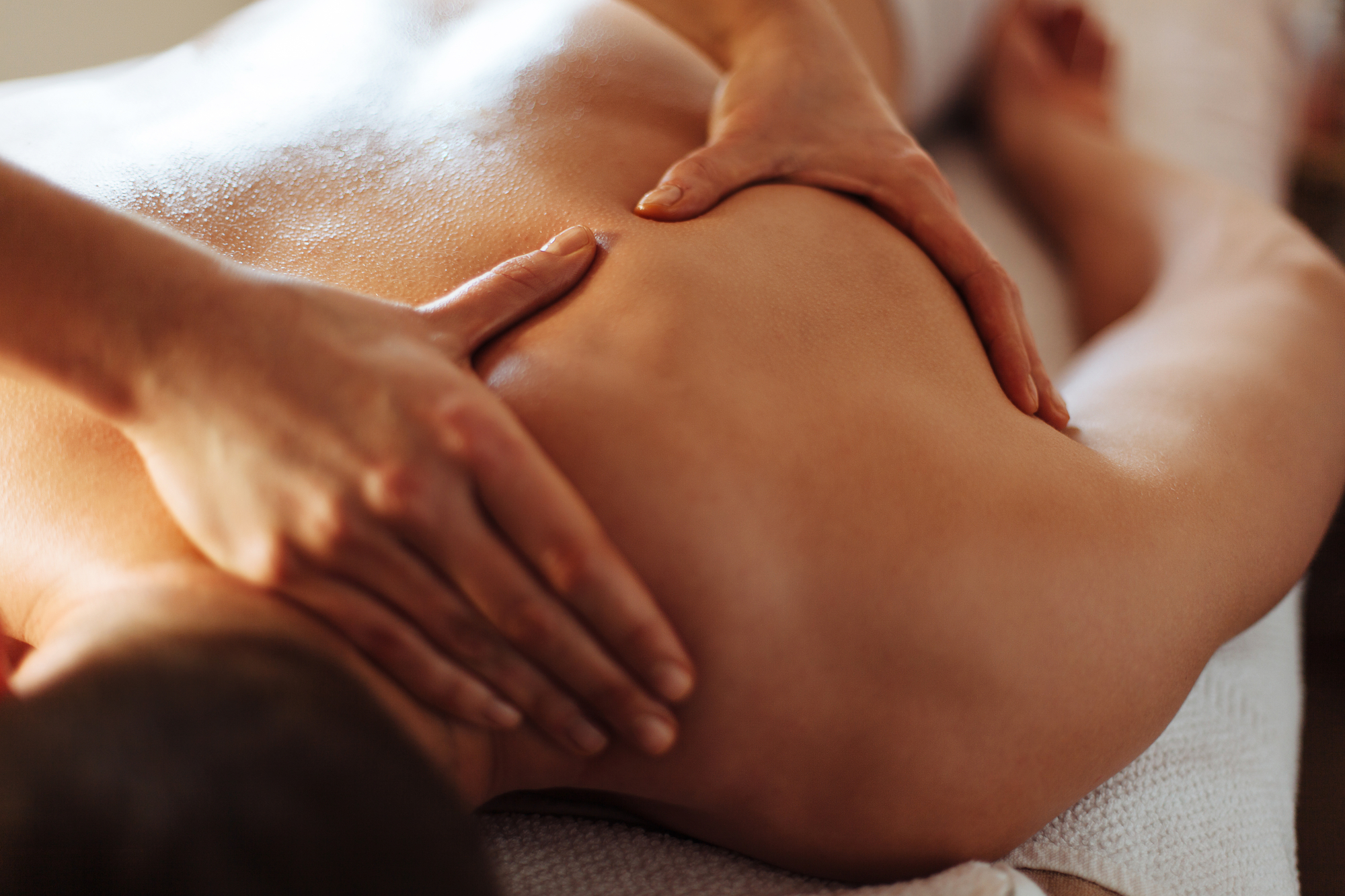 woman receiving a therapeutic back and shoulder massage