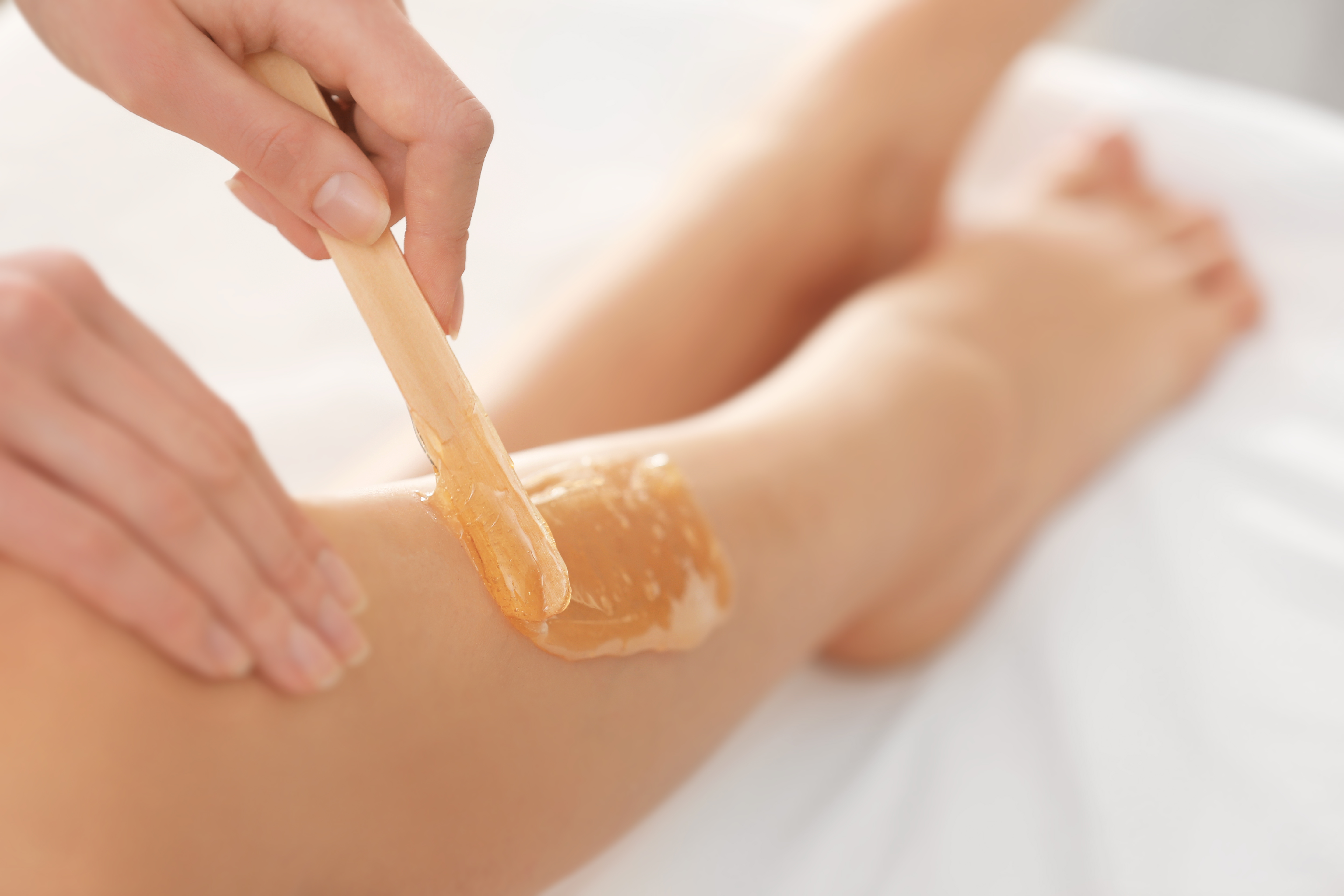 Leg being waxed for hair removal