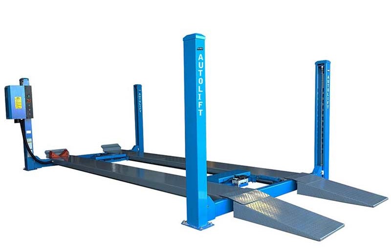 A blue automotive hydraulic lift, branded 'AUTOLIFT,' with a four-post structure designed for vehicle maintenance. It includes two ramps with a diamond plate pattern for traction, a control station with operation buttons, and a sturdy base connected by a flat metal track. The lift is set against a white background, highlighting its features for automotive service center use.