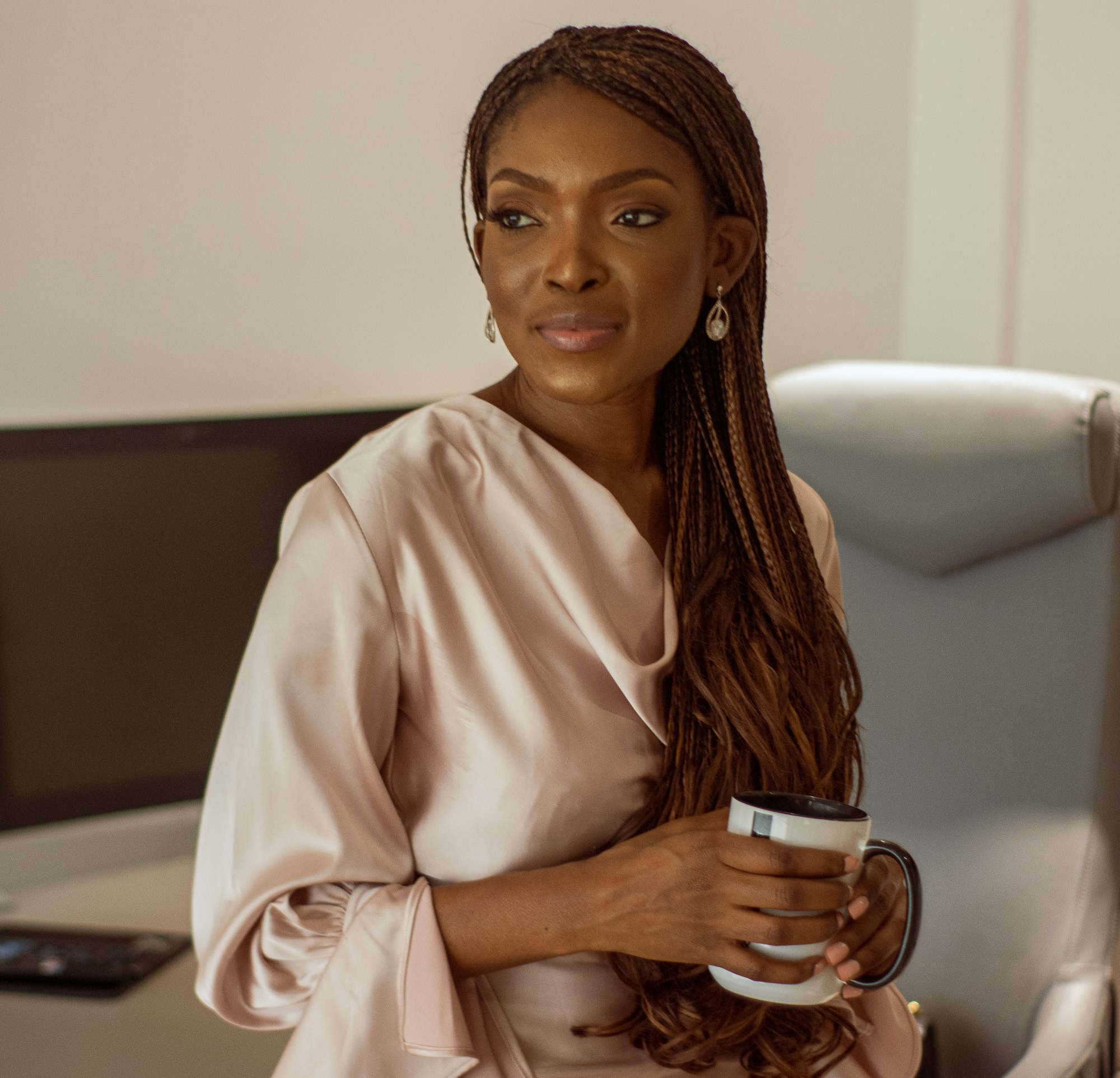 Interior designer working on a project from home, balancing work with family and wellness routines, while managing a startup business, interior architecture africa, interior design Nigeria, luxury furniture nigeria  