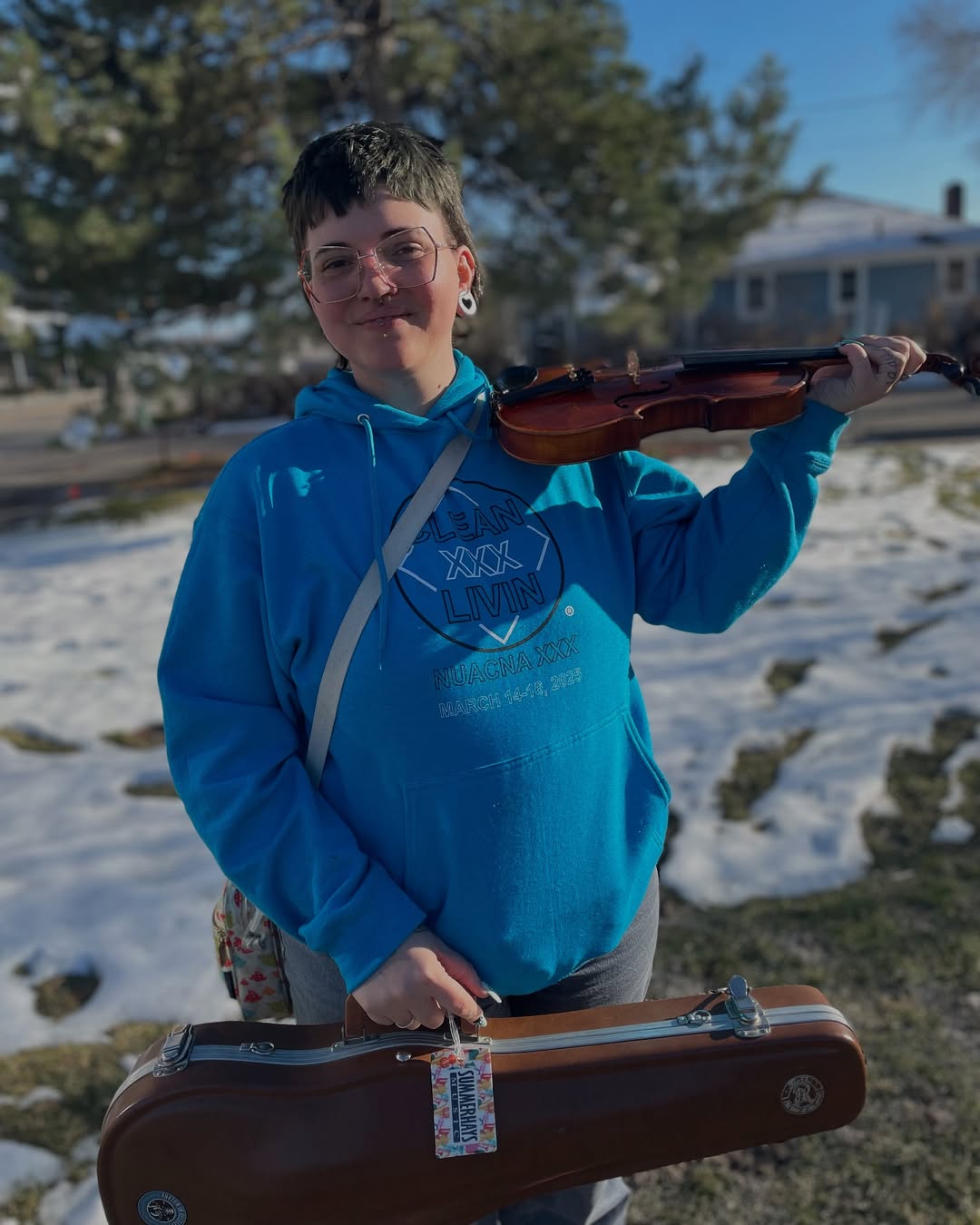 young woman holding a violin