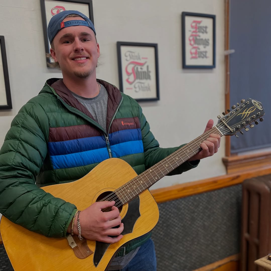 man holding a guitar