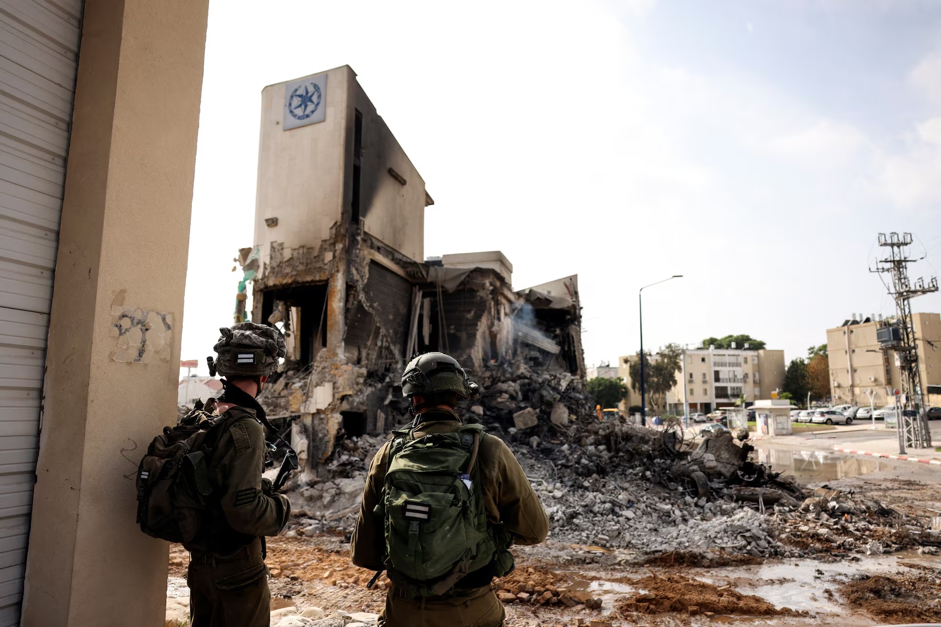 Israeli soldiers examine the ruins of the Sderot Police Station — the site of intense fighting after Hamas gunmen infiltrated from Gaza on October 7th.