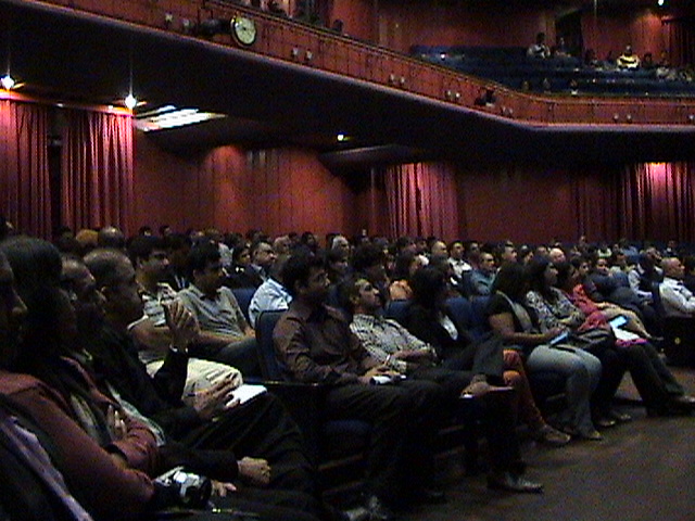 Vijay Mistri delivering keynote to large conference audience