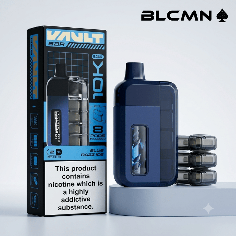 Studio 3D product photography of the Vault Bar 10K pre-filled pod kit showcasing a dark blue rechargeable device standing on a light blue platform beside extra replacement pods, accompanied by its matching product packaging box on a clean white background, branded with the BLCMN marketplace logo at the top right corner.