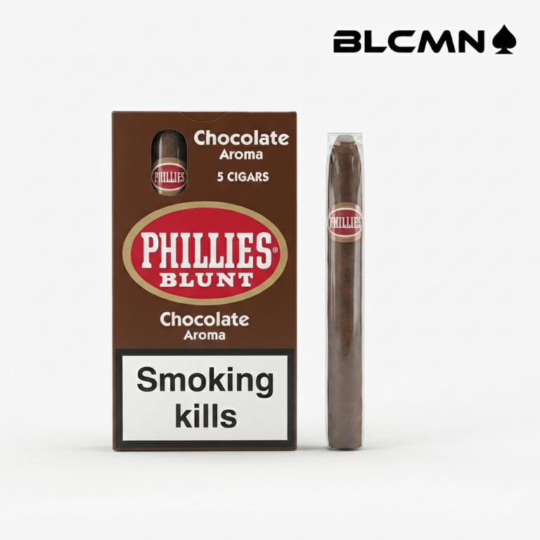 High 3D studio product photograph on a clean white background featuring a retail pack of Phillies Blunt Chocolate 5-pack cigars in sharp focus on the left with a "Smoking kills" warning label, accompanied by an unboxed single Phillies Blunt Chocolate cigar resting upright on the right. The black typography logo "BLCMN♠️" is placed in the top right corner.