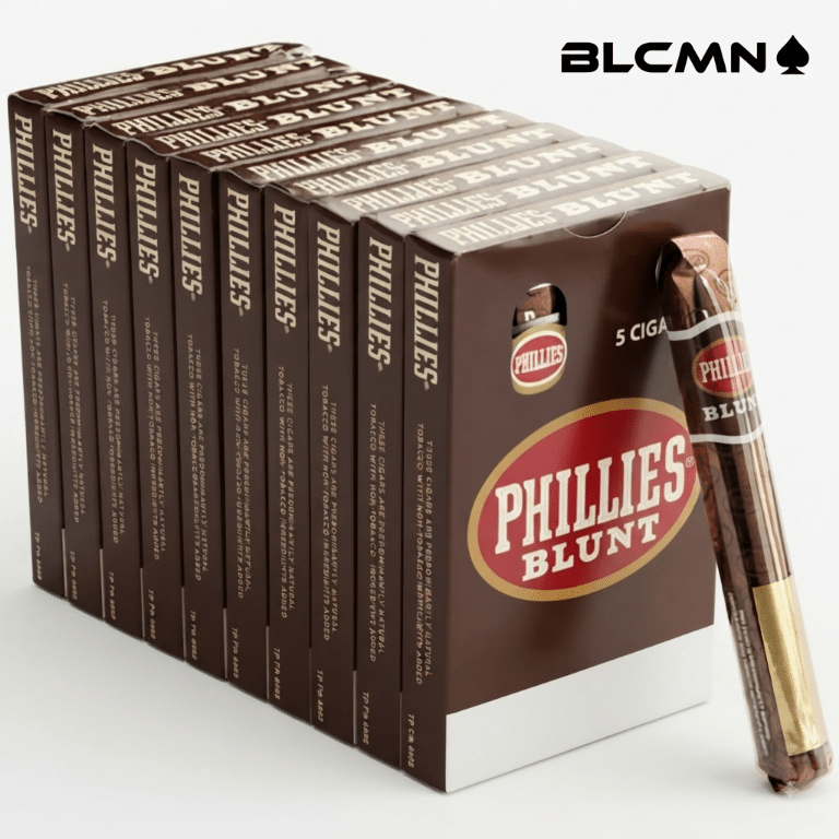 High 3D studio product photograph on a clean white background showcasing a full master box of Phillies Blunt Chocolate cigars neatly arranged with 10 individual 5-pack boxes standing in a row, accompanied by an unboxed single cellophane-wrapped cigar leaning against the front right corner. The black typography logo "BLCMN♠️" is placed in the top right corner.