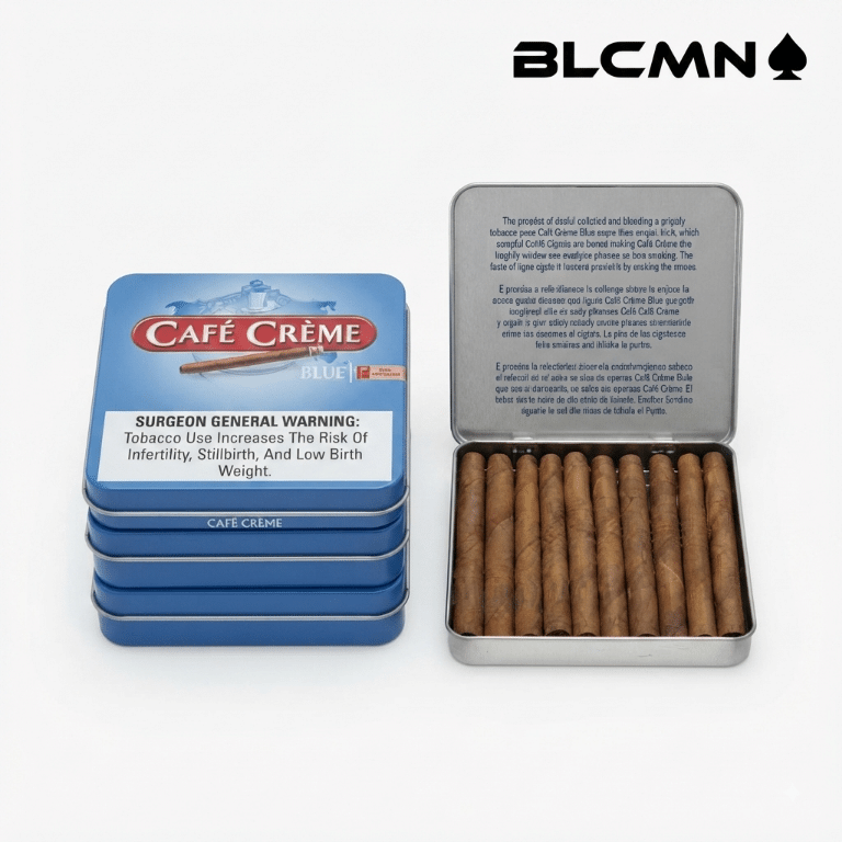 A high-resolution, studio 3D product photograph on a clean white background showcasing a stack of blue Cafe Creme Blue metal retail tins next to an open tin displaying ten miniature dry-cured cigarillos inside. The black typography logo "BLCMN♠️" is placed in the top right corner.
